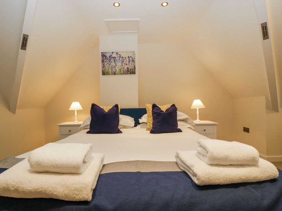 A bedroom with a bed and pillows at Bell Garden in Stow-On-The-Wold