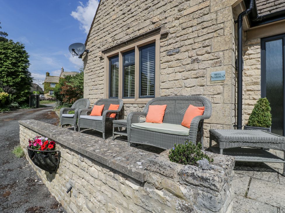 An outdoor seating area with chairs and a table at Bell Garden in Stow-On-The-Wold