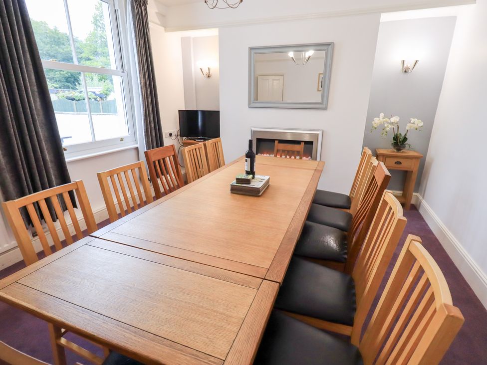 A dining room with a wooden table and chairs at Hazelmere in Keswick
