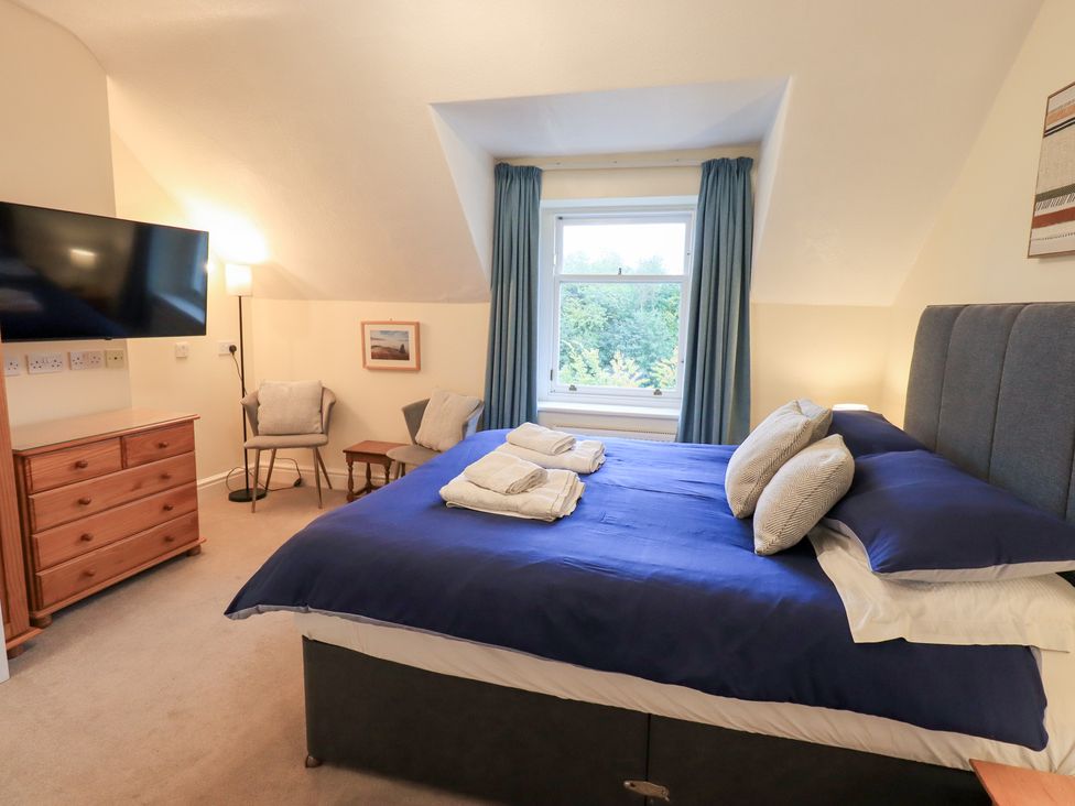 A bedroom with a bed and television at Hazelmere in Keswick