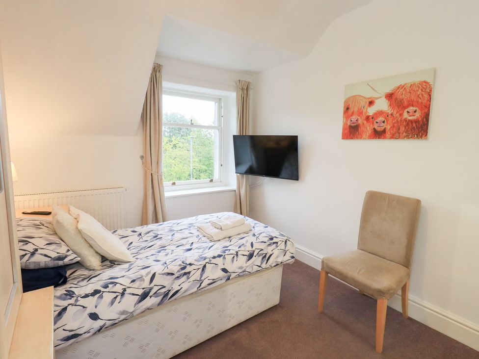 A bedroom with a bed and a television at Hazelmere in Keswick