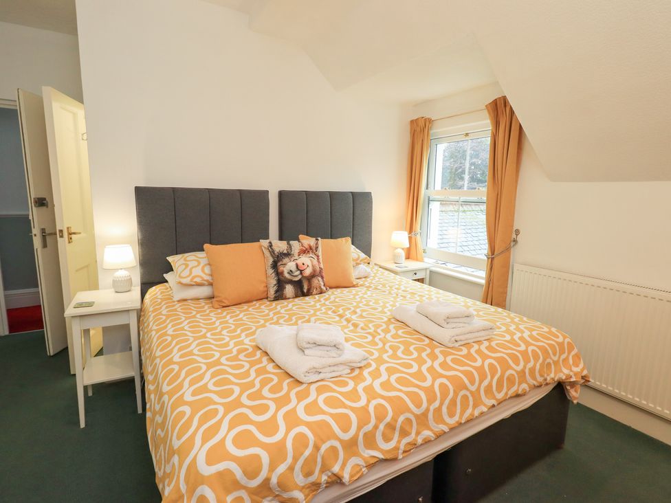 A bedroom with a bed and window at Hazelmere in Keswick