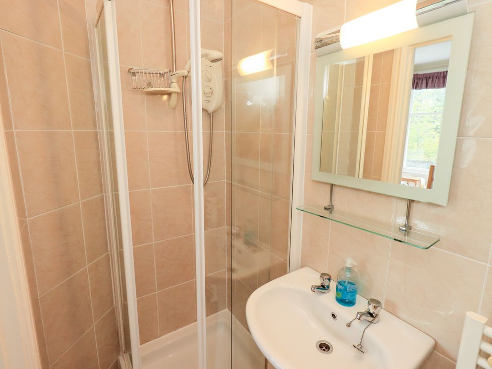 A bathroom with a shower and sink at Hazelmere in Keswick