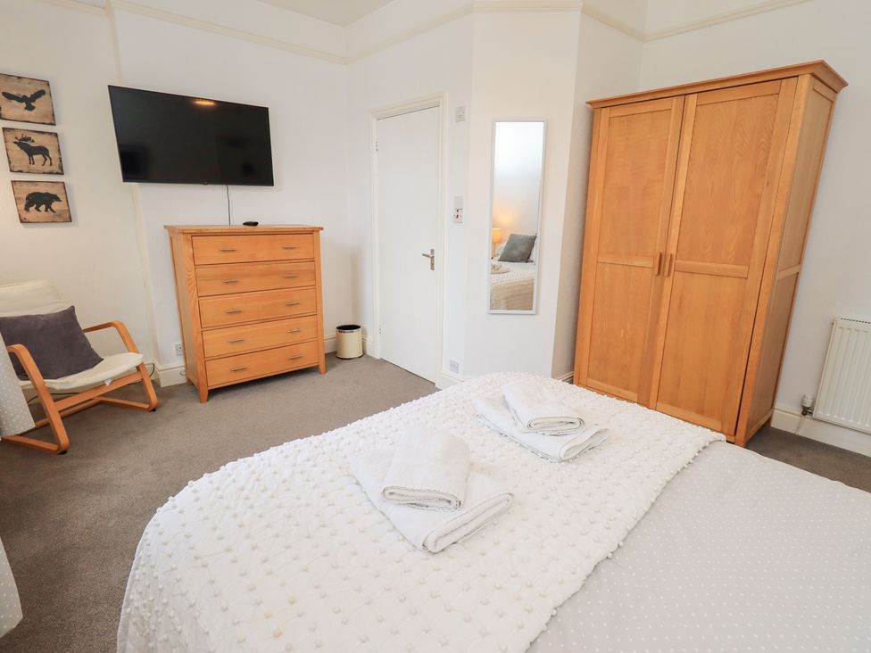 A bedroom with a bed and wardrobe at Hazelmere in Keswick