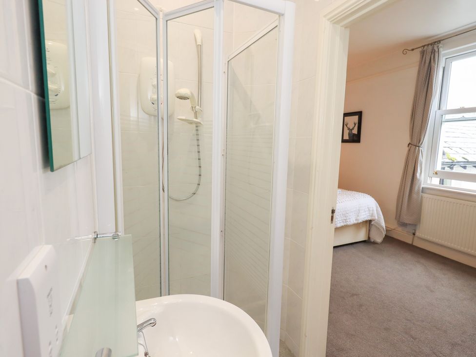 A bathroom with a shower and sink at Hazelmere in Keswick