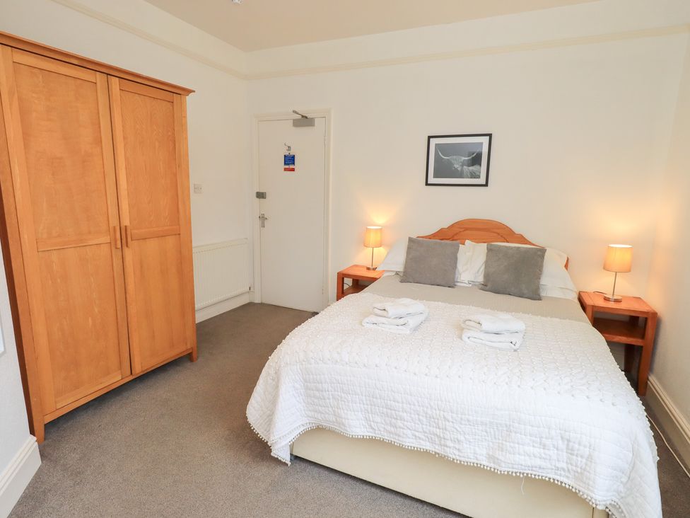 A bedroom with a bed and wardrobe at Hazelmere in Keswick
