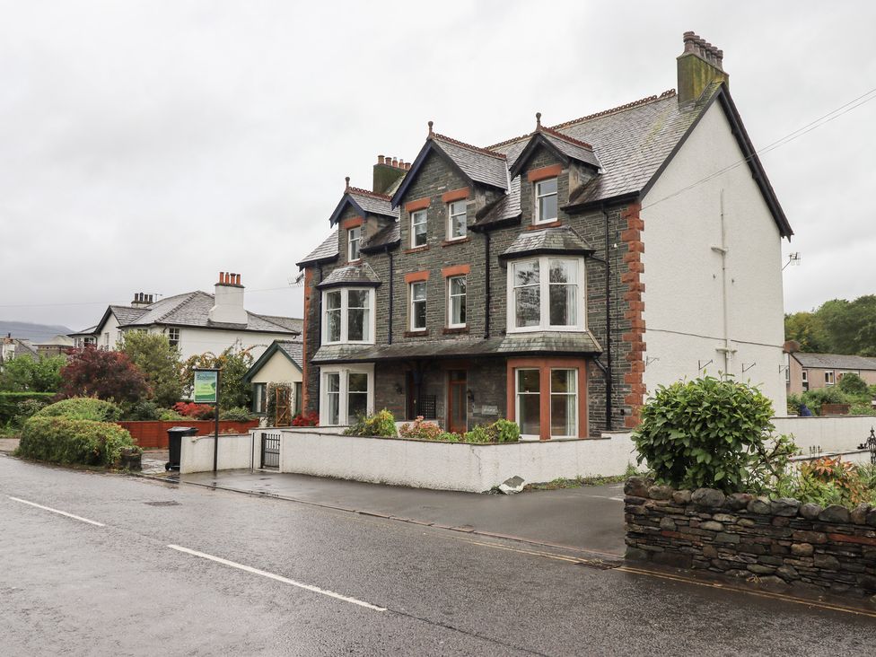 A house with multiple windows and a front yard at Hazelmere in Keswick