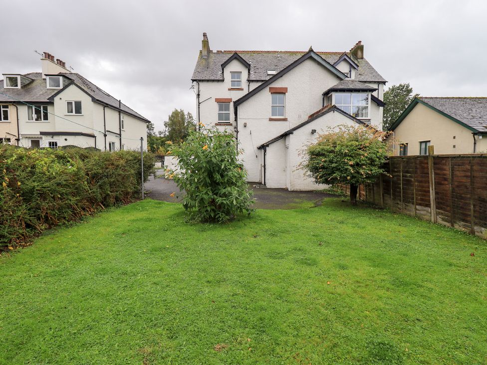 A garden with a house and fence at Hazelmere in Keswick