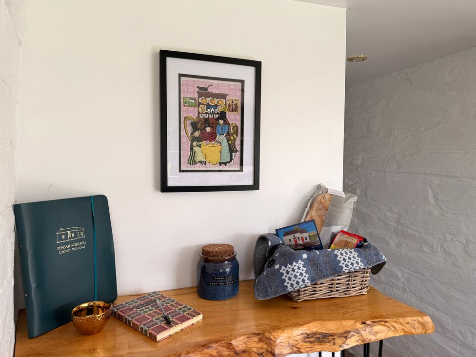 A corner display with artwork and various items at Pensarngerrig Rhydlewis