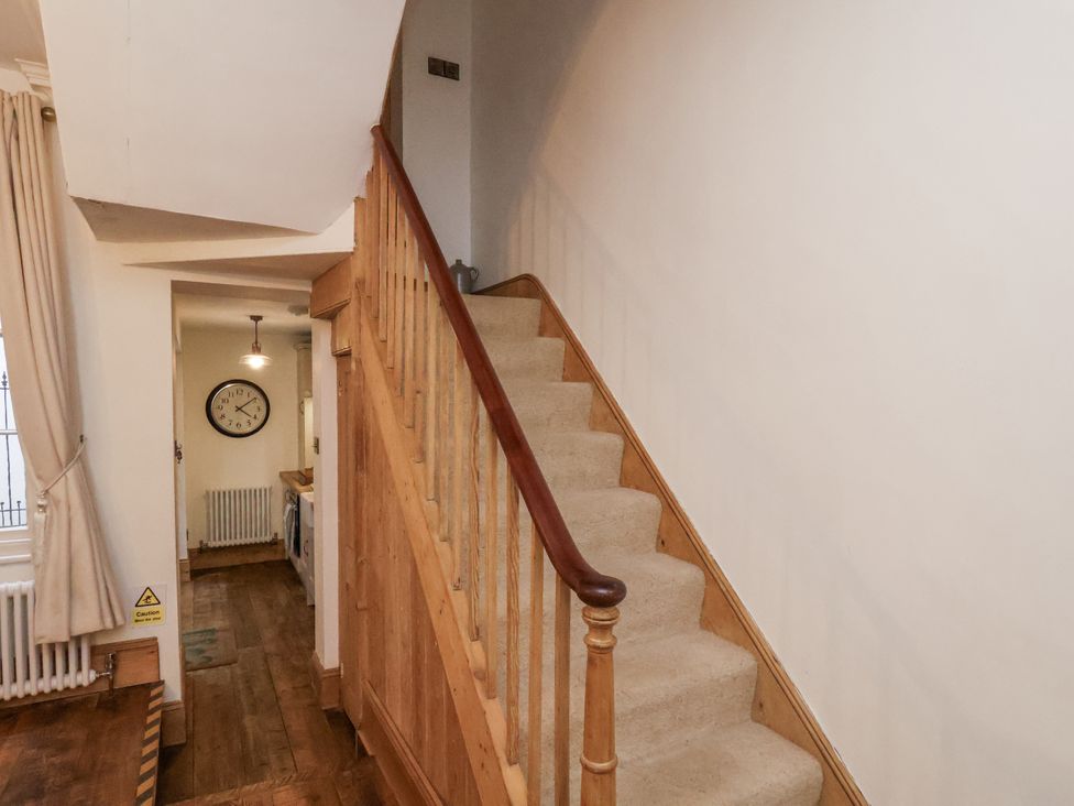A staircase in a hallway at Charlotte House in Whitby