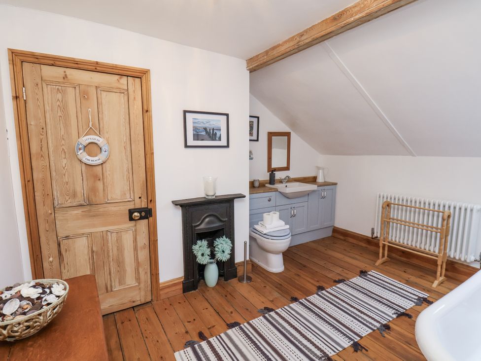 A bathroom with a sink and toilet at Charlotte House Whitby
