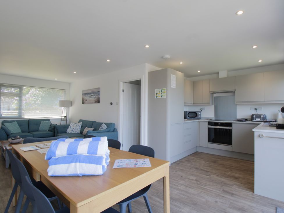 A living room and kitchen area at 65 Channel View Ilfracombe