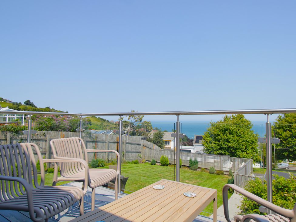 A balcony with seating and a view of the sea at 65 Channel View Ilfracombe