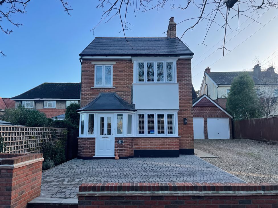 A house with garage and driveway at The Chocolate Box in Weymouth