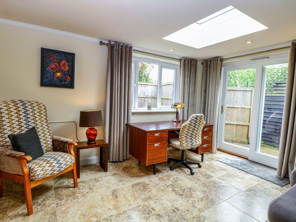 An office with a desk and chair at Birch Cottage in Brundall