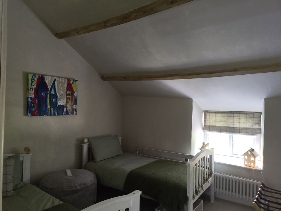 A bedroom with beds and an artwork at Islwyn in Llanuwchllyn near Bala