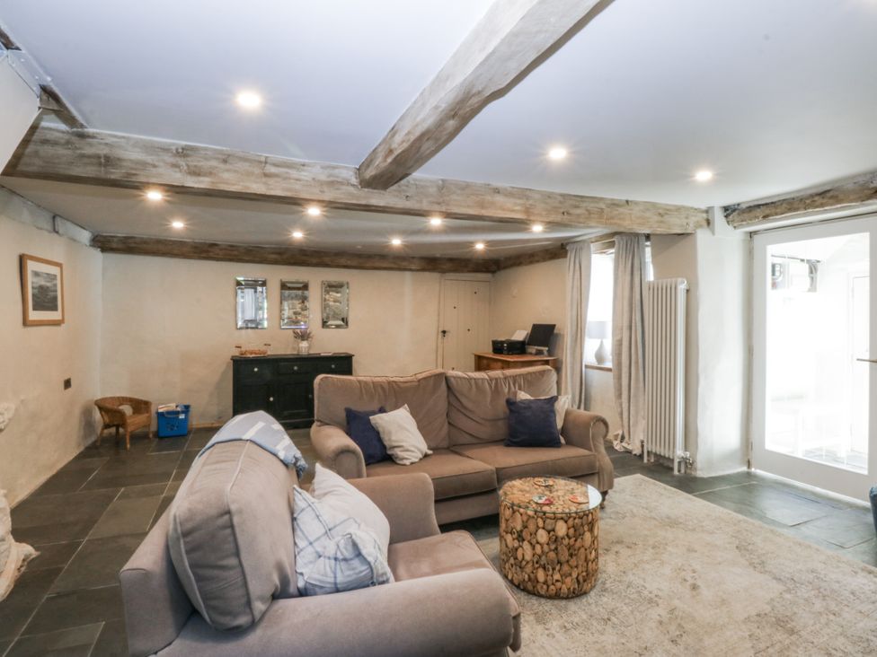 A living room with a sofa and coffee table at Islwyn near Bala