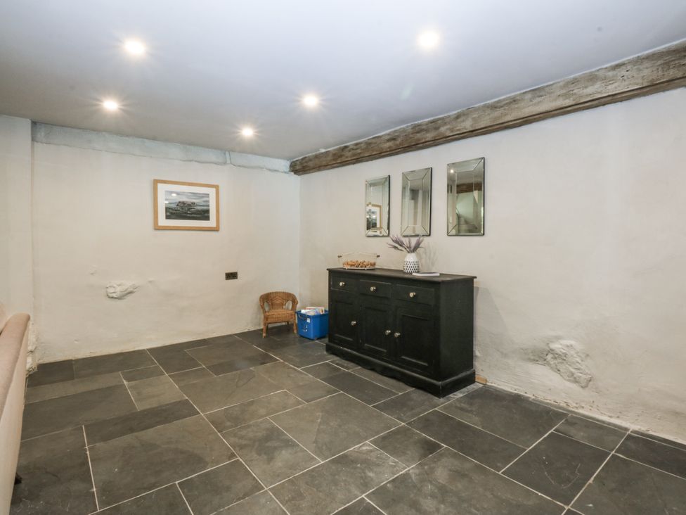 A room with a storage cabinet and mirrors at Islwyn Llanuwchllyn near Bala