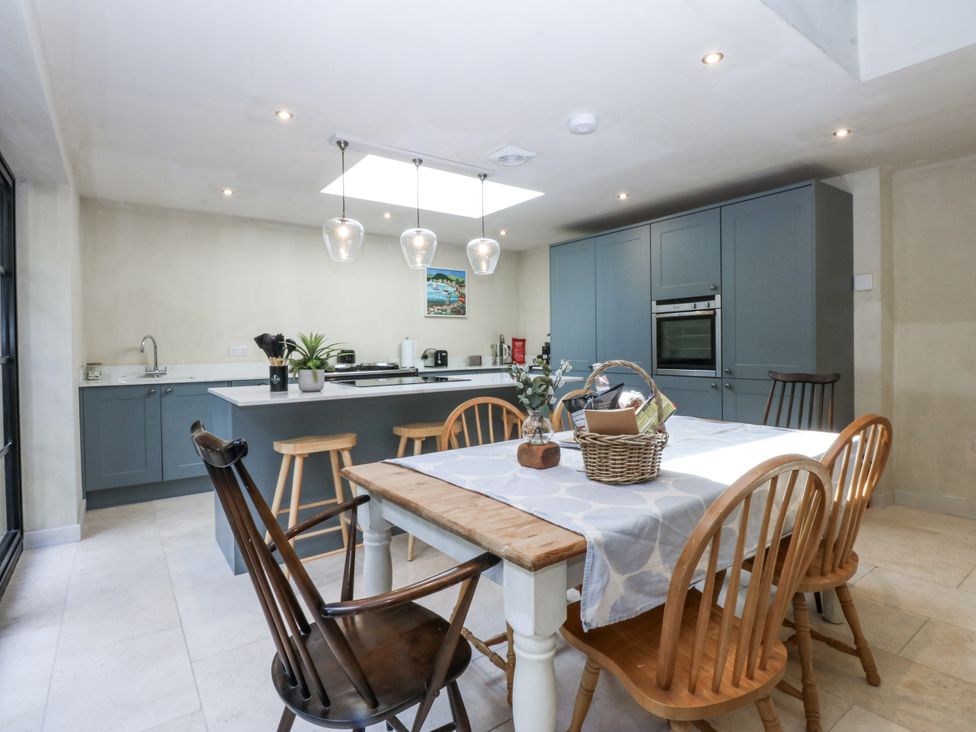 A kitchen with a table and chairs at Islwyn near Bala