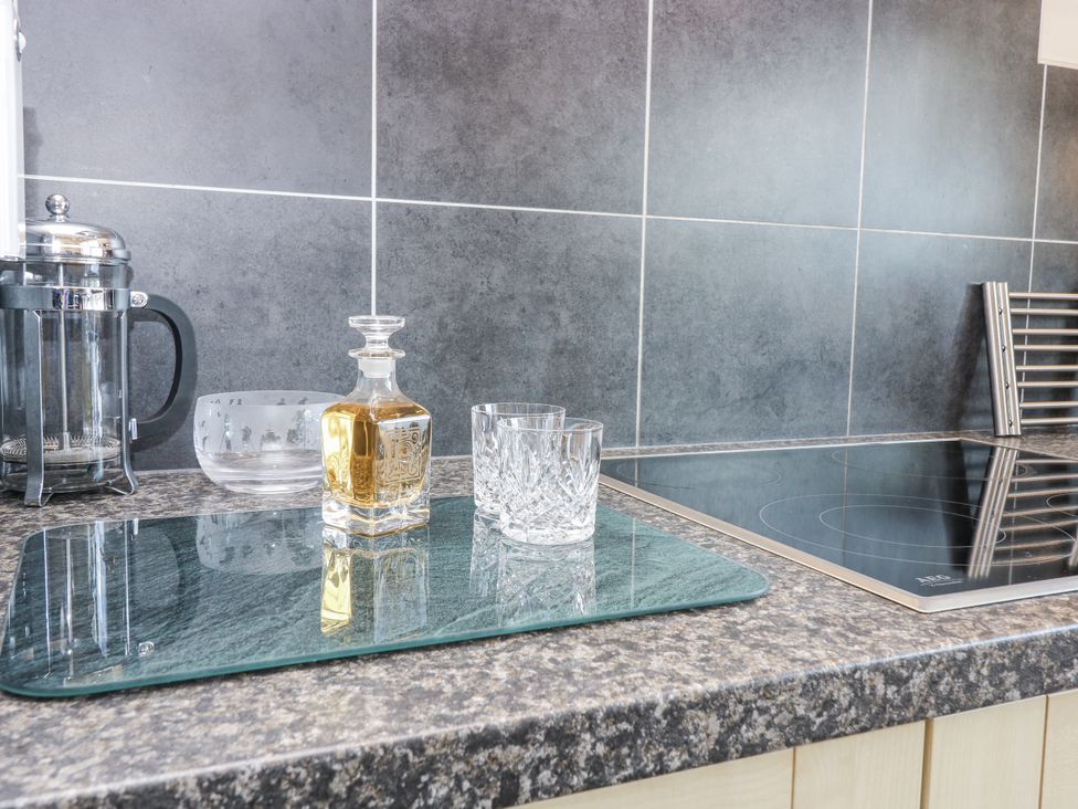 A kitchen countertop with a coffee press and a decanter at 6A Pitlethie Steading Leuchars