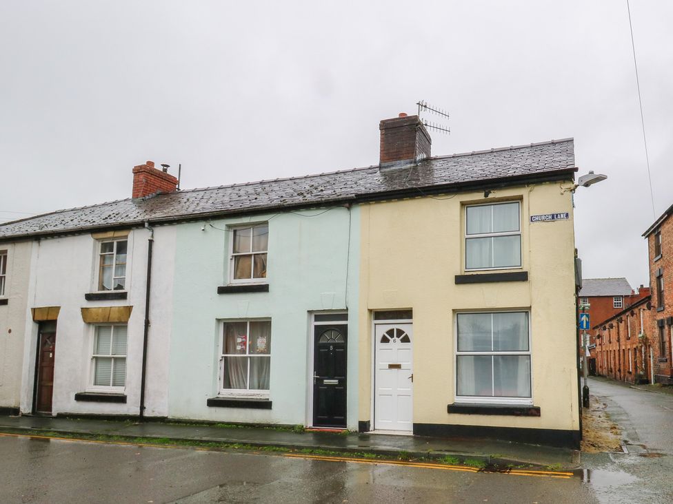 A terraced house with doors and windows on Church Lane in Llanidloes