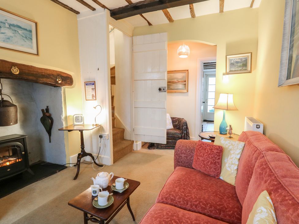 A living room with a sofa and coffee table at 6 Church Lane in Llanidloes