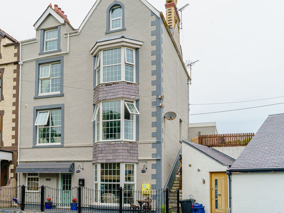 An exterior view of a three-story building with multiple windows at Y Graiglwyd, Bull Bay near Amlwch