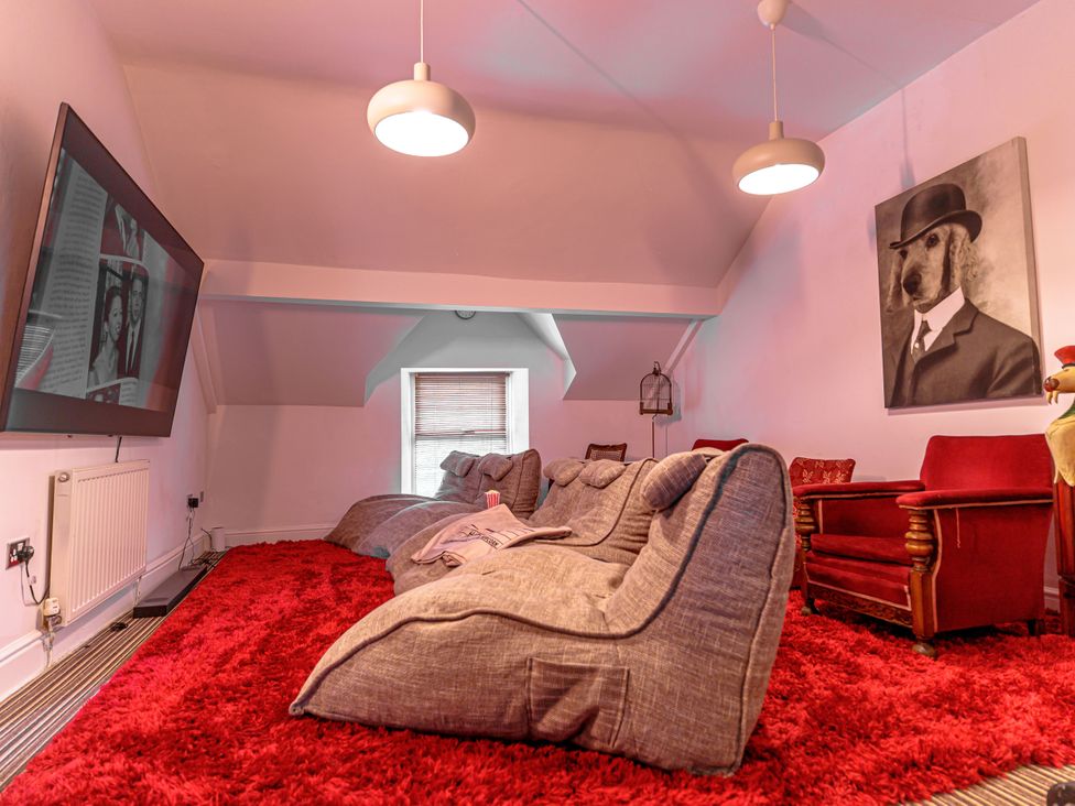 A snug with bean bag chairs and a television at Y Graiglwyd Bull Bay near Amlwch