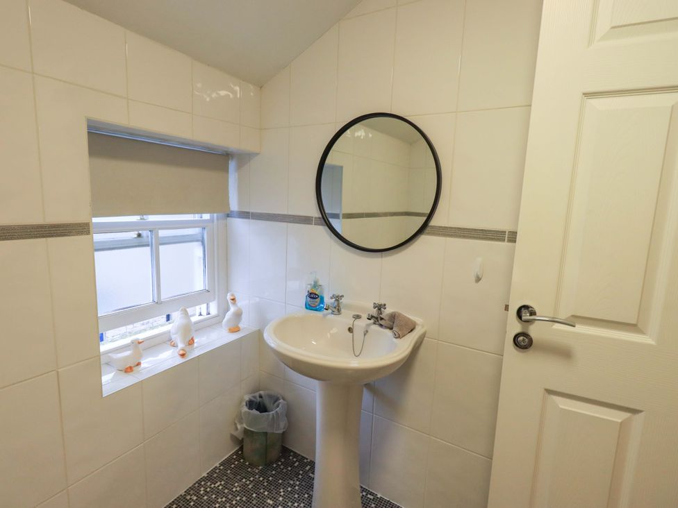 A bathroom with a sink and a mirror at 21 Entry Lane in Kendal
