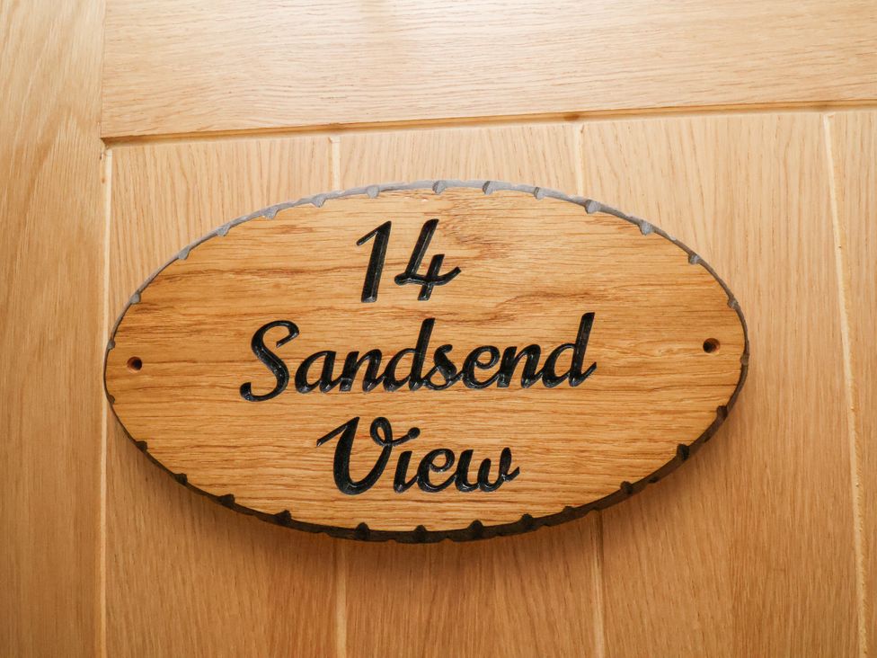 A name plate showing 14 Sandsend View in the entryway of the property