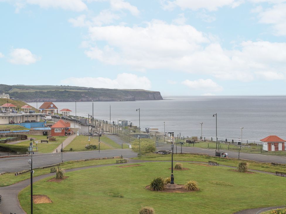 A coastal view with a park and walking path at Sandsend View Whitby