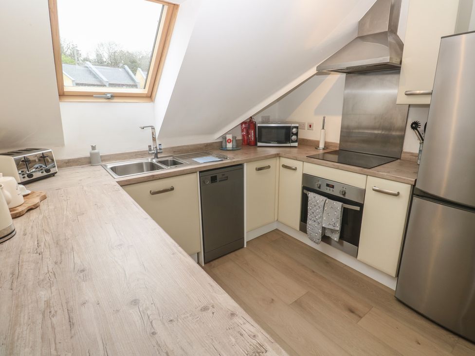 A kitchen with appliances and countertop at Upper Deck in Truro