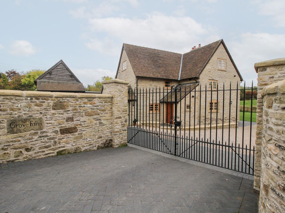 A view of a house and gate at Grove Farm in Cardington near Church Stretton