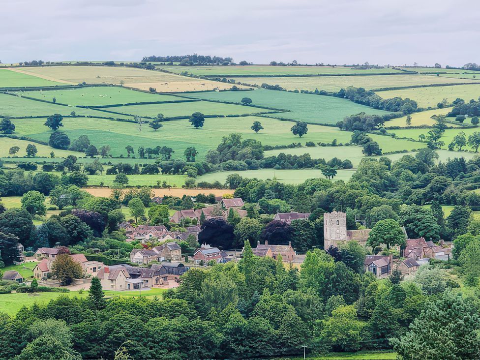 A view of a village and fields at Grove Farm Cardington near Church Stretton
