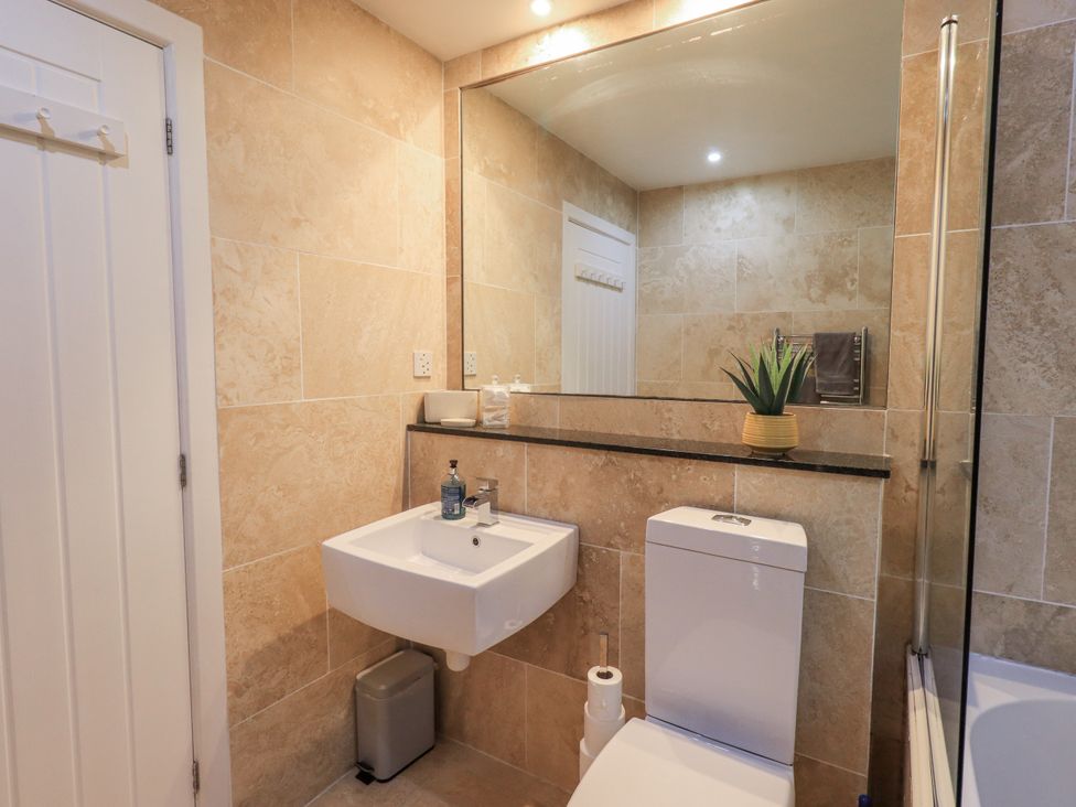 A bathroom with a sink and toilet at 8 Beechwood Close Bowness-On-Windermere