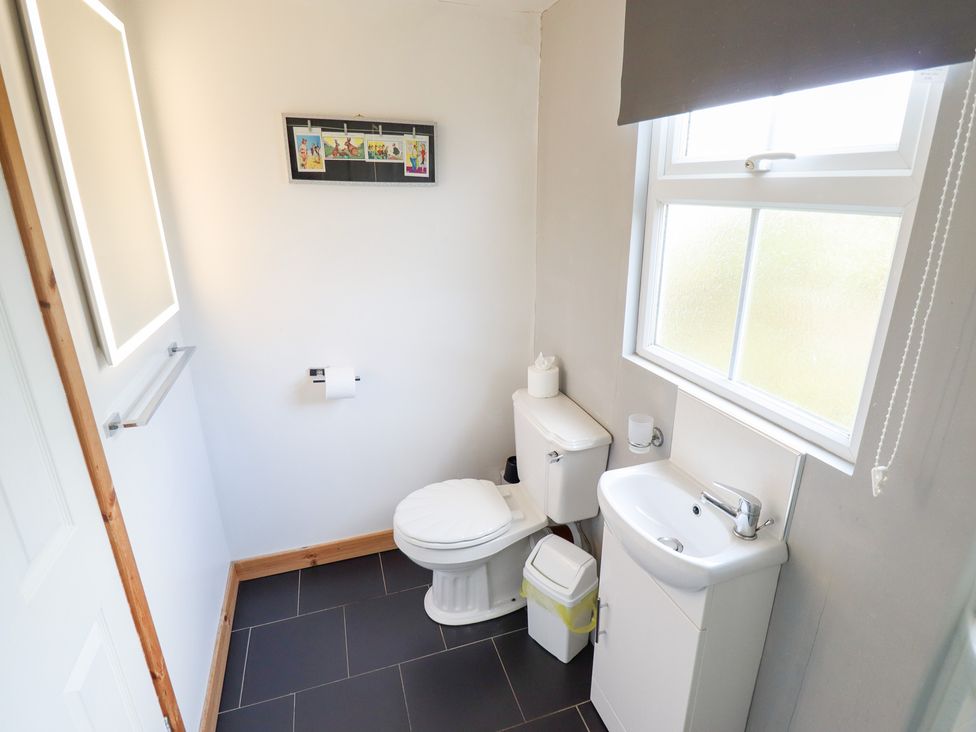 A bathroom with a toilet and sink at Angel's Retreat in Huttoft