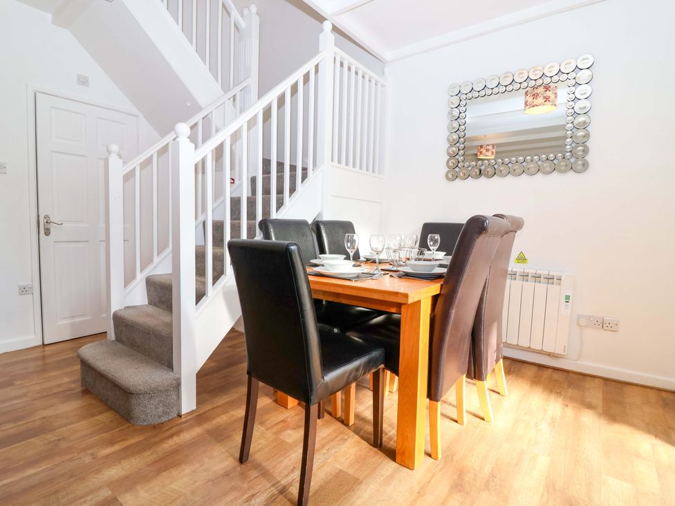 A dining room with a table and chairs at Roughtor Cottage St Tudy