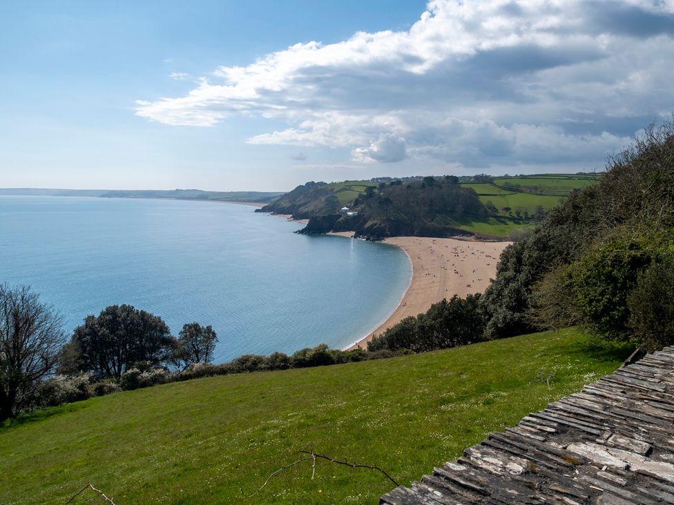A beach with a view of hills and clouds at 38 Venn Park Stoke Fleming