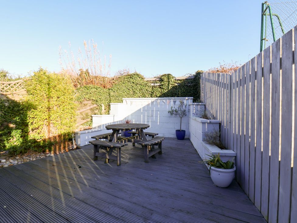A garden with a table and benches at Pond Farm View in Hinderwell