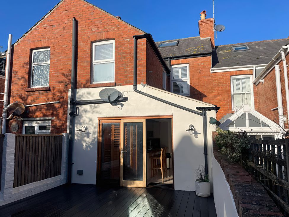 An outdoor view of a house with windows and doors at Owl's Rest in Weymouth