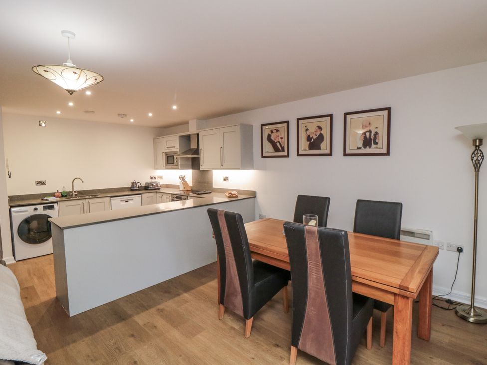 A dining room with a table and chairs at Apartment 1, 19 Cleveland Terrace, Whitby