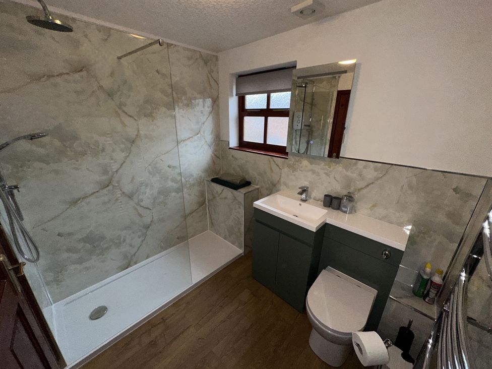 A bathroom with a shower and sink at Eric House in Filey