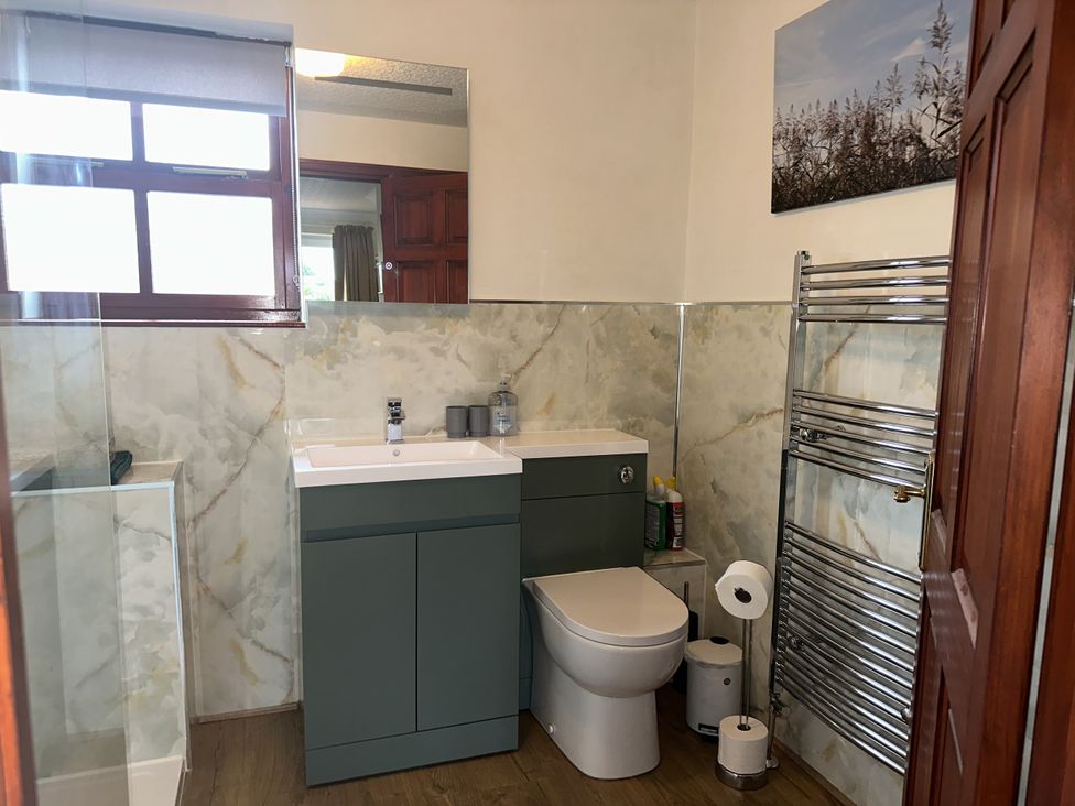 A bathroom with a sink and toilet at Eric House in Filey