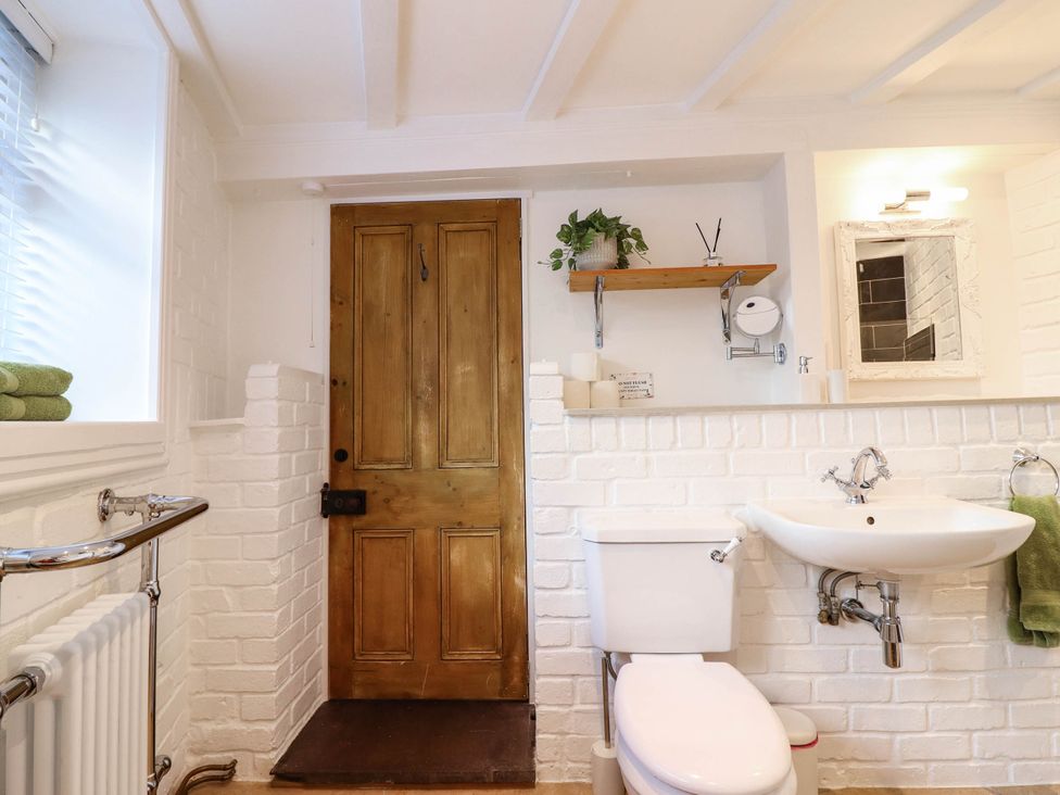 A bathroom with a sink and toilet at 18 Church Street in Llangollen