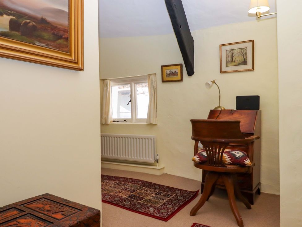 An office with a desk and chair at Fox Hat Cottage in Chagford