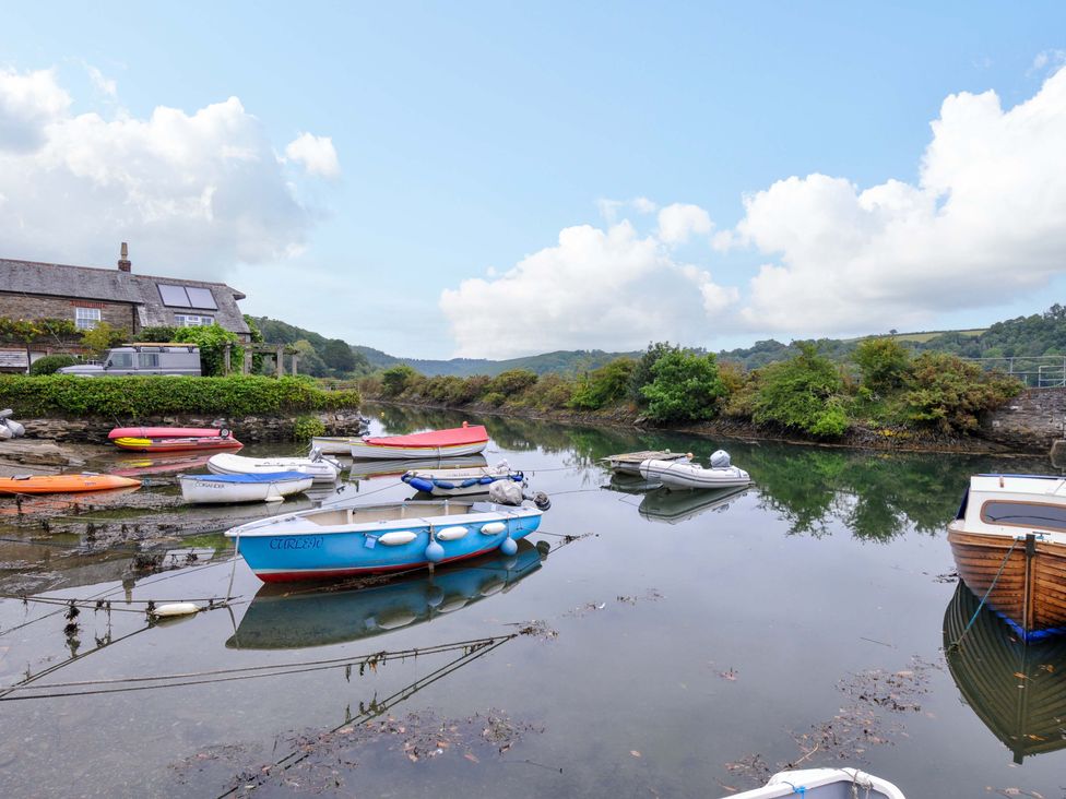A scene with boats on a river at Island House Golant near Tywardreath