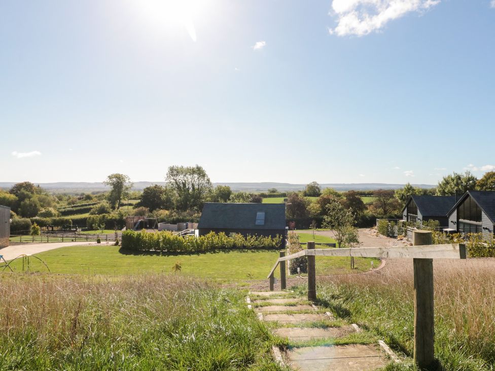 A landscape view of houses and trees at Foxes Den in Allerston near Thornton Dale