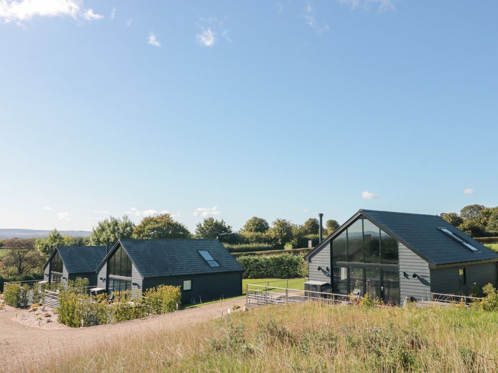A view of modern houses in a field at Foxes Den in Allerston near Thornton Dale
