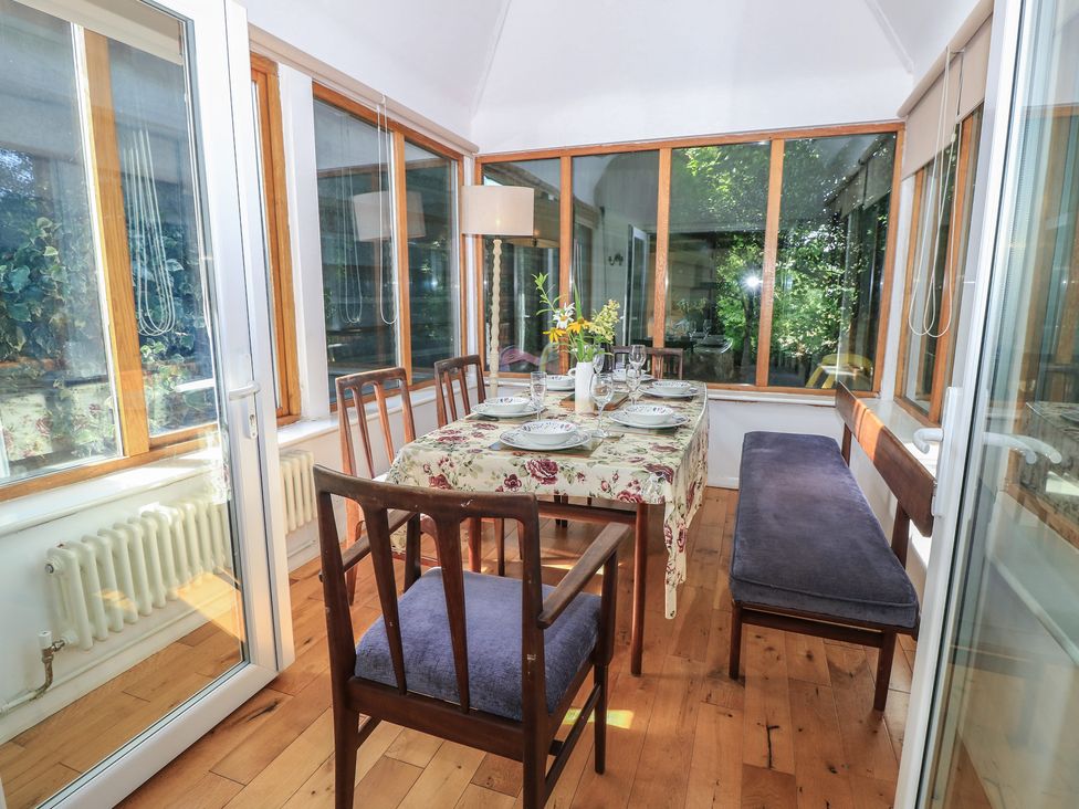 A dining room with a table set for meals at Byre Cottage 4 Sullington near Storrington