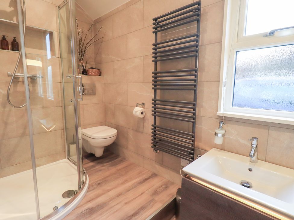 A bathroom with shower, toilet, and sink at West View near Leasgill